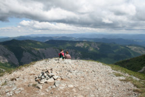 A couple takes in the breathtaking view after a strenuous hike to the top of Silver Star Mountain.