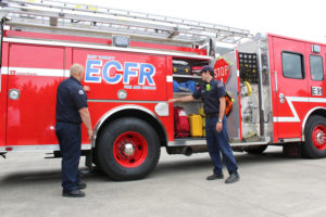 East County Fire and Rescue Fire Captain James Troutman (left) and part-time firefighter-EMT Nollan Charles (right) show the inner contents of ECFR Station 91's new $400,000 fire engine, purchased with equipment reserves. The district needed a new engine, but had tight budget constraints, so did not go for one with "all the bells and whistles," said Fire Chief Nick Swinhart (not pictured). 