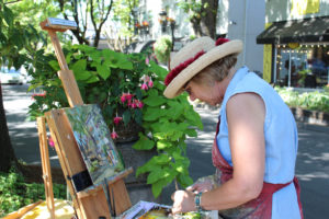 Artist Anna Norris paints en plein air "in the open air" during the 2017 Plein Air art event in downtown Camas. This year's event, featuring several artists working "in the open air," will take place throughout the day, Friday, Sept. 7. (Post-Record file photo)