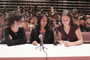 Camas High Youth Advisory Council (CYAC) members (from left to right) Julia Bintz, Kayla Cameron and Sydney Fermenick prepare for the 16th annual CYAC Candidate Forum, held Monday, Oct. 22, at Camas High School. 