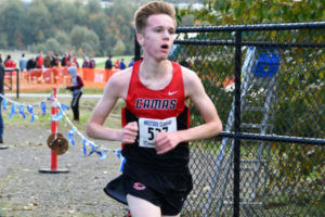 The Camas girls cross-country team holds their first-place bi-district trophy at Chambers Bay Golf Course, Oct. 27. (Courtesy of Michelle Maton)