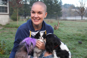 Amanda Giese cuddles Bunny (center) an 8-week-old rescue puppy born with malformed front limbs, as two of her own pet dogs come in for a closer sniff. Giese, of Washougal, and her family, which includes two Washougal High students, are the stars of the new Animal Planet show, "Amanda to the Rescue," which airs at 9 p.m., on Sundays. 