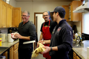 Firefighters from the Camas-Washougal Fire Department help out in the kitchen of the Camas Community Center during a free community breakfast on Christmas Eve, Dec. 24. Pictured from left to right are firefighter-paramedic Shayne Bradley, firefighter-paramedic Capt. Greg Weisser and firefighter-paramedic Trevor Guay. 