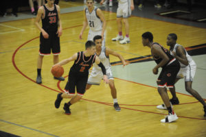 Camas basketball player Carson Bonine takes on rivals from Union High at a game on Dec. 17. 