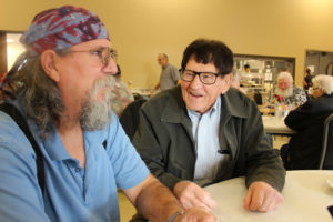 Charlie Walker (left) and Leon Malfait (right) crack jokes at the Washougal Senior Center on Monday, Jan. 7. 