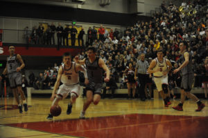 Papermaker point guard Carson Bonine drives the lane against the Union Titans on Jan. 18.