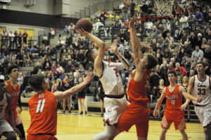 Camas senior and floor leader Carson Bonine draws a foul in the final seconds of overtime during a Jan. 30 game against the Battle Ground Tigers. 