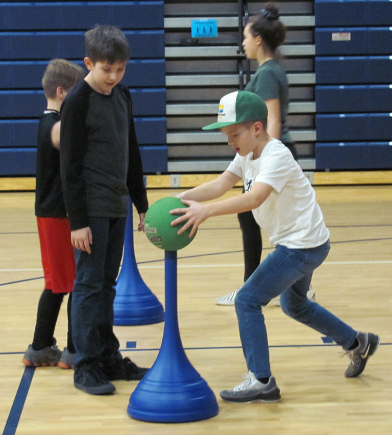 Owen Minnis (right) performs an agility exercise with Jacob Benson watching during Washougal School District&#039;s Family Fitness event.