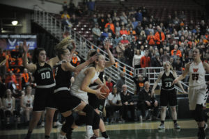 Beyonce Bea draws a foul from a triple team in crunch time in the 2A title game against East Valley on March 2.  Bea scored 12 points in the overtime period. 