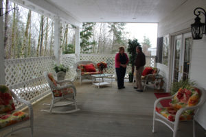 Brenda Davis, who owns Ireland Greens Adult Family Home in Camas with her husband, Richard (not pictured), demonstrates a hydraulic Hoyer lift in a resident's room.