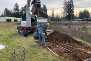 Deep holes are drilled to support two solar powered scoreboards at George Schmid Park in Washougal. (Photo by Mike Plinski)