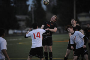 Washougal senior Carter Murray goes up for a header against White Salmon on Thursday, March 14.  Murray hasn't played soccer since he was 10 years old, but the all-league basketball player decided to give soccer a shot in the last few months of his senior year. 