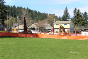 Demolition crews work at the site of the former Crown Park swimming pool in Camas on March 29. With the city's only public swimming pool now demolished, Camas Mayor Shannon Turk said Monday this may be the best time for the city to ask voters if they support building a new community center with recreation pool. 