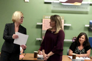 Washougal School District Superintendent Mary Templeton (left) swears in Washougal School Board Director Angela Hancock (center) while board director Donna Sinclair (right) looks on, during a September 2018 school board meeting. (Post-Record file photo)