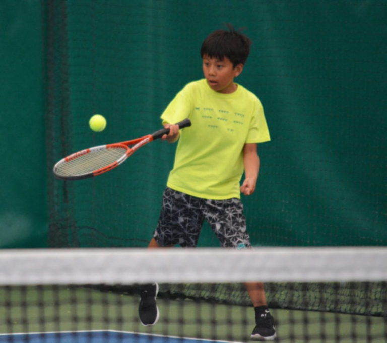 Tenzin Dhargyad returns a volley during a 2017 Summer Blast tennis tournament at the Evergreen Tennis Center in Camas.  Evergreen Tennis will offer a variety of tennis camps in Camas this summer. Small-group camps are taught by professional tennis instructors and groups are divided by age and ability, from beginner to advanced. For more information or to register, visit register.cityofcamas.us.