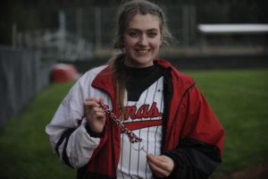 Camas senior Mary Pipkin shows a custom key that everyone on the softball team carries to remind them that all players are equal. 