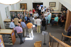 A crowd gathered inside the Camas Public Library on Friday, April 26, awaits the unveiling of the Virginia M. Lethlean Holland Warren Collection.