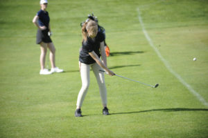 Washougal sophomore Kailee Neyer chips a shot onto the No. 6 green at Orchard Hills Country Club.  Neyer shot a 58 as the Panthers dropped the match to Hockinson, on April 29.