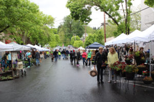 Visitors to the 2017 Camas Plant and Garden Fair didn't let a little rain prevent them from sampling the more than 100 art vendors. This year's event should have better weather. The forecast for May 11, one day before Mother's Day, is calling for sunny skies and temperatures in the high 80s. (Post-Record file photo)