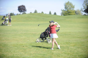 Camas senior Emma Cox fires a shot into hole 18 at Tri-Mountain Golf Course in Ridgefield in round one of the district tournament on Monday, May 6. (Wayne Havrelly/Post-Record)