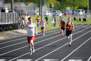 Camas senior Blake Derringer finishes strong in the 400 meters against Battle Ground on April 30.  Derringer specializes in the 100 meters, but his  talent in the 400 gives the Camas team more options as they defend the state track and field title.