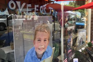 A  photo of Camden Linton hangs in the window of Natalia's Cafe in downtown Camas. Natalia's Cafe in downtown Camas is hosting a carnival fundraiser from noon to 5:30 p.m., with a silent auction until 7 p.m., today to support Camden, who was recently diagnosed with an inoperable brain tumor, and his family. 