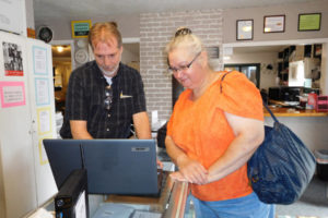David Lamb, co-owner of Silver Star Computers and Solutions in Washougal, helps customer Kathleen Washenberger with a laptop computer issue last year. Lamb died in June at the age of 55. (Post-Record file photo)