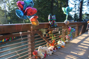 Friends of Anthony Huynh, the 14-year-old boy who drowned in Lacamas Lake on Aug. 20, have placed balloons, photos and messages of love on the Camas pedestrian bridge crossing the lake. (Photos by Kelly Moyer/Post-Record)