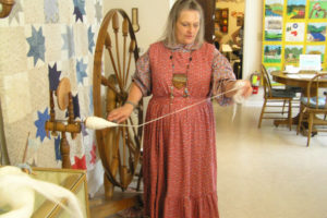 Amanda Ediger demonstrates a spinning wheel at the Two Rivers Heritage Museum in Washougal during the 2018 Heritage Day event. This year's Heritage Day festivities will take place Saturday, Sept. 14 at the Washougal museum. (Contributed photos courtesy of Clark County Historical Society)