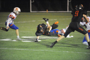 Washougal High School's Brevan Bea catches a pass late in the first half of the Panthers' Oct. 4 game against Ridgefield High School. After the play he left the game with a rib injury. (Wayne Havrelly/Post-Record)