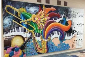 A mural created by Camas High School freshman Tara Hansen incorporating a visual interpretation of sound, music and the "feeling of jazz" decorates the side of Skyridge Middle School. (contributed photo courtesy of Jane deForest Hansen)