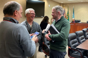 Camas Mayor Barry McDonnell (right) speaks to Camas residents John Ley (center) and Ernie Geigenmiller (left) at his first city council meeting in December 2019. McDonnell, a last-minute, write-in mayoral candidate, beat incumbent Mayor Shannon Turk in the November 2019 general election. (Photo by Kelly Moyer/Post-Record)