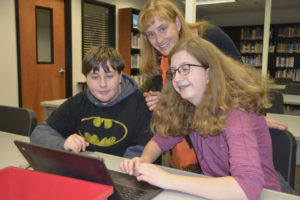 Washougal High School librarian Hillary Marshall assists sophomore Jennifer Trask (left) and freshman Erica Allen with a project. (Contributed photos courtesy of Washougal School District)