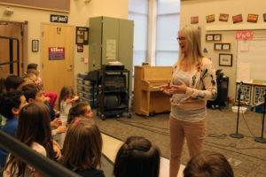 (Photo by Kelly Moyer/Post-Record)
Grass Valley Elementary School music teacher Natalie Wilson (right) teaches a group of kindergarten students on Dec. 19. Wilson, who has taught at Camas schools for 35 years and leads one of the only elementary school-level vocal jazz ensembles in the United States, will soon be inducted into the Washington State Music Educators Association's Hall of Fame. 