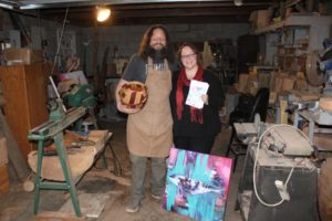 John and Anni Furniss display some of their artwork in their Washougal woodshop on Thursday, Jan. 23. The artists created Love Fest, an art bazaar and community gathering, which will be held Saturday, Feb. 8 at the Black Pearl on the Columbia in Washougal. (Doug Flanagan/Post-Record)