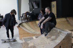 Rochelle Ramos (center) and John Henriksen, owners of Lunchmoney Indoor Skate Park, observe the form of Ramos' son, Timothy, on Jan. 23, in Washougal. (Doug Flanagan/Post-Record)