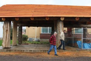 Richard Johnson (left), a Two Rivers Heritage Museum board director, and Jason Ferrier, a project manager for Camas' Lewallen Architecture, walk out of The Gathering Place structure in Washougal on Feb. 6. The pavilion is scheduled to be completed this summer, according to Ferrier. (Photos by Doug Flanagan/Post-Record)