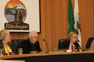 Washougal City Councilman Ernie Suggs (right) nominates Molly Coston (second from left) to continue as Washougal's mayor during a January Washougal City Council meeting. (Doug Flanagan/Post-Record)