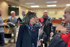 Newly elected Camas City Councilwoman Shannon Roberts (center) speaks to Camas Mayor Barry McDonnell's wife, Stacy McDonnell, after a Camas City Council meeting on Dec. 2, 2019.  (Kelly Moyer/Post-Record)