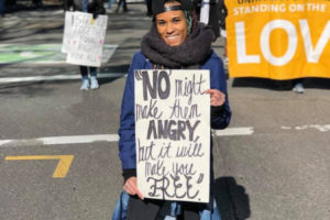 Washougal High School teacher Charlotte Lartey holds a "'No' might make them angry, but it will make you free" sign at a Black Lives Matter march. (Contributed photo courtesy of Charlotte Lartey)