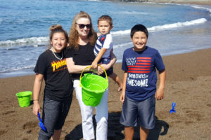 Sandra Ladd, (second from left), is pictured with her grandchildren (left to right): Emma Sasse, Hunter Sasse and Ben Sasse in an undated photo. Ladd, 61, was found murdered in her Washougal home in June. Police and Crime Stoppers of Oregon are asking for the public's help to solve Ladd's murder. (Contributed photo courtesy of Mikaela Sasse)