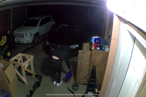 A still photo from a video provided by the Skamania County Sheriff's Office shows a person allegedly setting fire to a garage in Carson, Wash., on July 22. Sheriff's deputies arrested 18-year-old Michaela J. Cutler, of Camas, in connection with the fire. She has been charged with attempted murder, first-degree arson, burglary and unlawful possession of firearms, and is being lodged in the Skamania County Jail in lieu of $500,000 bail. (Video courtesy of Skamania County Sheriff's Office)