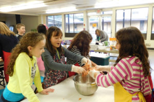 Camas students participate in an after-school cooking class in 2017. Current plans for the start of the 2020-21 school year call for Camas elementary students to attend in-person classes five days a week while older students will have a blend of in-person and distance-learning classes. The district also plans to offer remote options for families who do not feel safe sending their children to in-person classes during the COVID-19 pandemic. (Post-Record file photo)