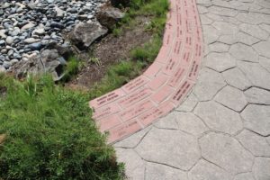 Engraved bricks line a path near the Chinook Plaza water feature in Parker's Landing Historical Park. (Post-Record file photo)