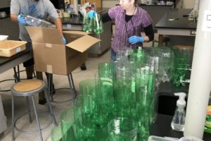 Canyon Creek Middle School science teachers Patrick Rice and Ryan Hooser prepare science supplies to send home to students earlier this year. (Contributed photo courtesy Washougal School District)