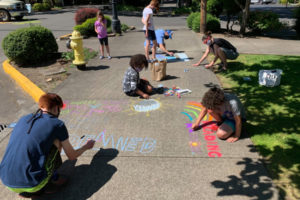 Community members create public art outside the Camas Public Library in July. (Contributed photos courtesy of Camas Public Library)