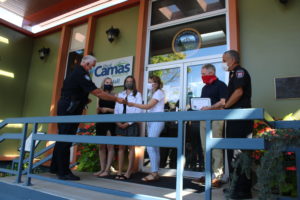 Camas Police Chief Mitch Lackey (left) thanks Vancouver teens (from left to right) Hannah Salinas, Hillary Darland and Maddy Gregory for rescuing a 5-year-old girl and her father at the Camas Potholes in July. Lackey, along with Camas Mayor Barry McDonnell (second from right) and Camas-Washougal Fire Chief Nick Swinhart honored the girls on Friday, Aug. 7, with a brief ceremony in front of Camas City Hall. (Photo by Kelly Moyer/Post-Record)