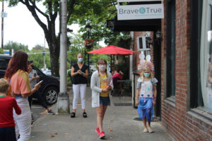 Camas photographer Lara Blair (left) leads her "Brave and True" camp participants in a "fashion parade" on Aug. 21. (Photos by Kelly Moyer/Post-Record)