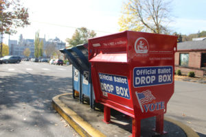 An official ballot drop box stands next to postal boxes on Northeast Fifth Avenue in downtown Camas on Oct. 16, 2020. (Kelly Moyer/Post-Record) 