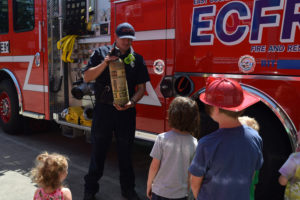 An East County Fire and Rescue firefighter speaks to children during an ECFR open house on July 29, 2018. (Post-Record file photo)